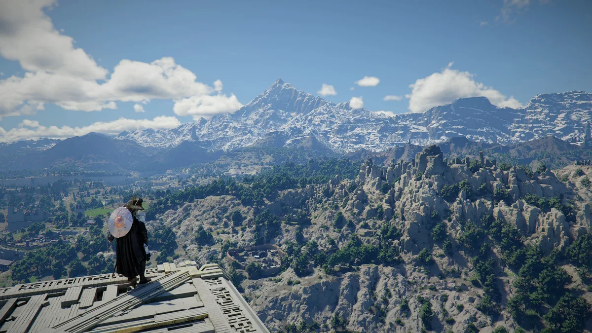 A character in Crimson Desert standing on a wooden platform overlooking a vast landscape with snow-capped mountains and lush green forests.