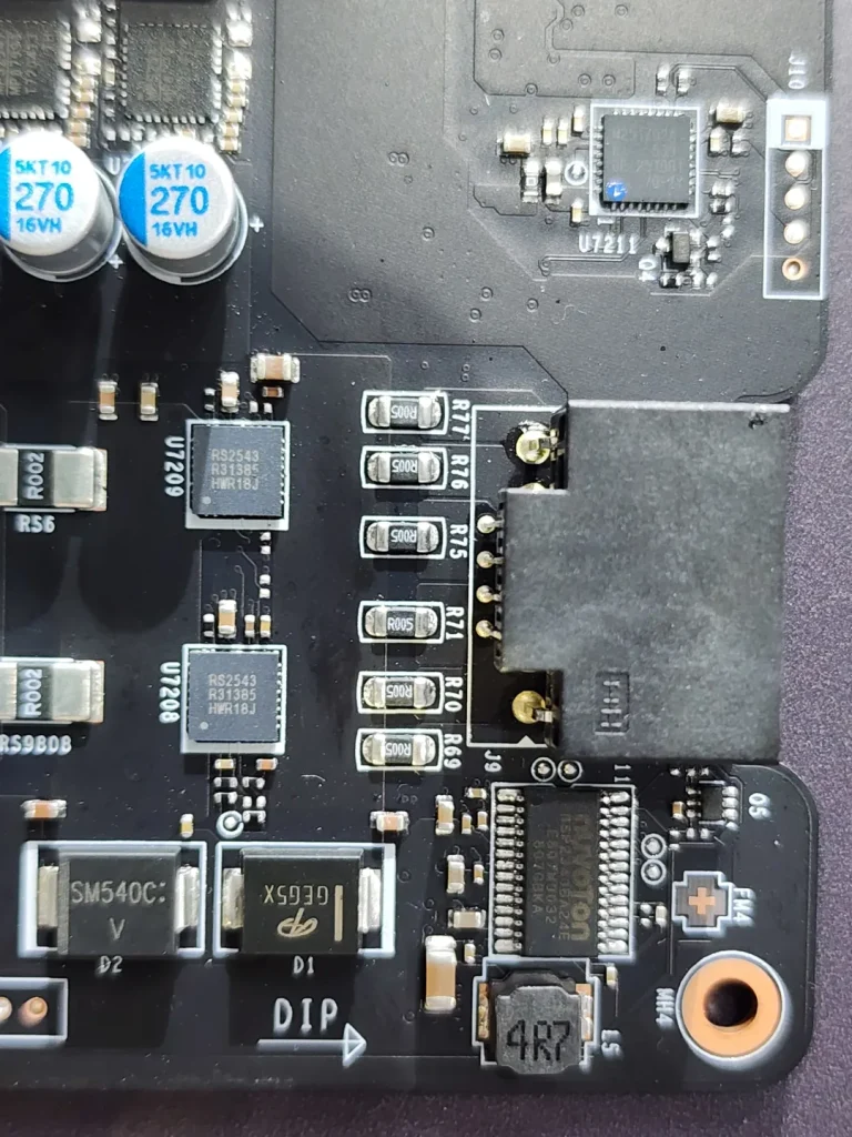 Close-up of a circuit board showing Samsung capacitors labeled '5KT10 270 16VH' and an Infineon chip with the designation '6EDL04N02E.'
