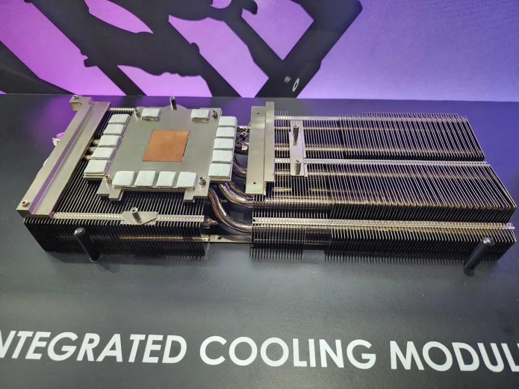 A close-up of an unbranded cooling module with visible heat pipes and fins on a surface labeled 'INTEGRATED COOLING MODULE'.