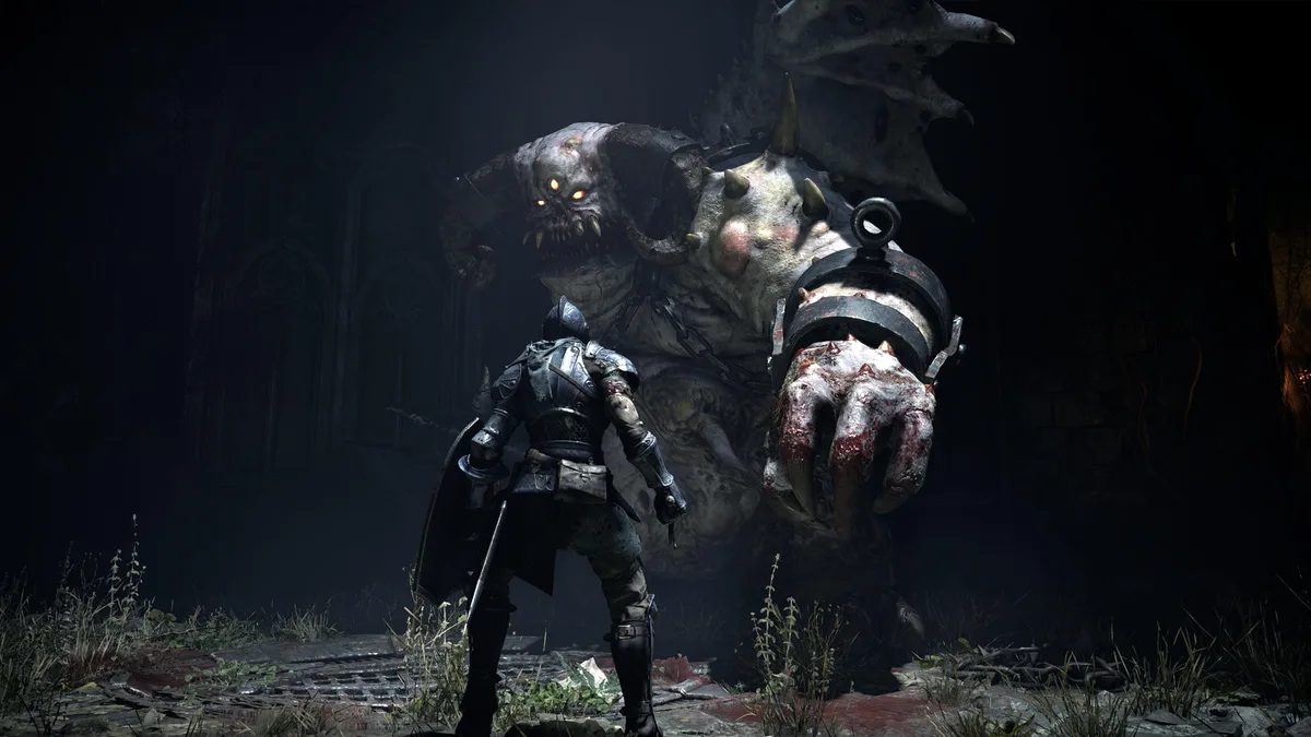 emulador PS5 SharpEmu — A knight character in'Demon's Souls' confronts a large, horned demon in a dark, gothic setting.