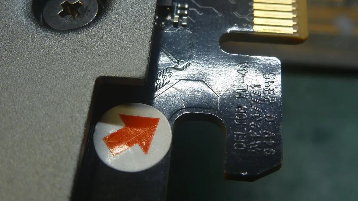 Close-up of a Delton ML-44 expansion card with visible gold contacts and the text'DELTON ML-44 A4/G V2.3/77'.