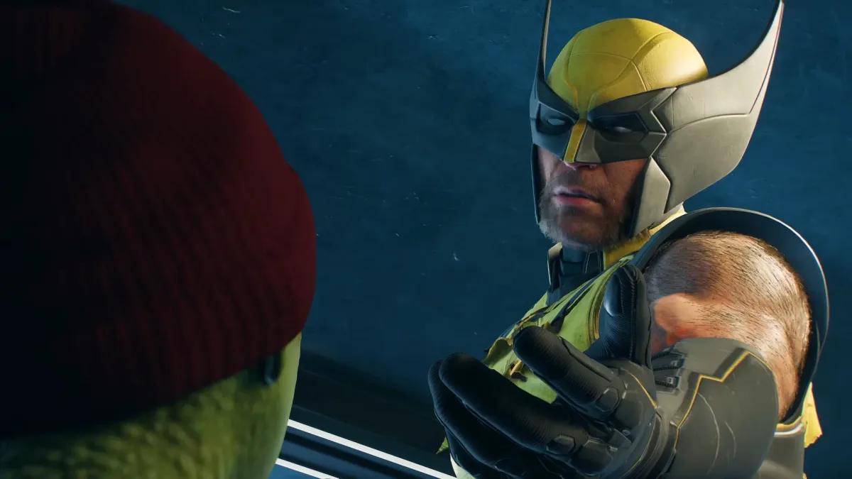 Marvel's Wolverine — Wolverine holding out his hand to a young mutant in Marvel’s Wolverine.