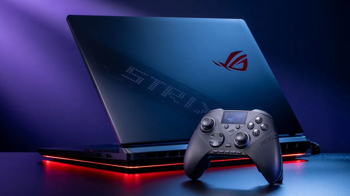 rog raikiri pro joystick — The ROG Raikiri II Pro PC Controller beside an ROG Strix laptop on a black table.