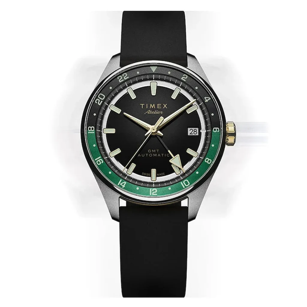 Timex Atelier GMT Première M1a with a black dial, green 24-hour GMT ring, and black NBR rubber strap.
