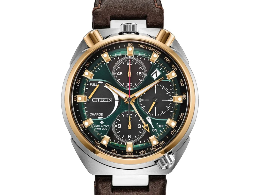 Citizen Promaster Tsuno Chrono Racer AV0104-06W with a two-tone stainless steel case, emerald green dial, black chronograph subdials, and brown leather strap.