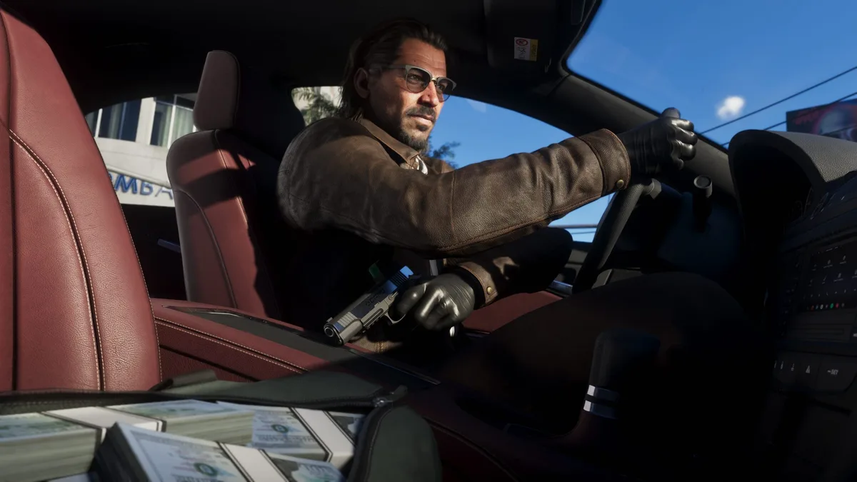 A character in'Grand Theft Auto VI' is driving a car with stacks of money and a gun visible in the passenger seat.