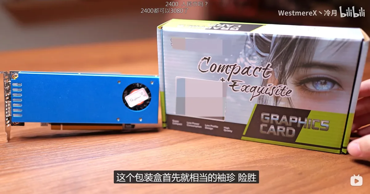 RTX 3060 — An unbranded blue graphics card sits next to its box labeled'Compact + Exquisite GRAPHICS CARD' on a wooden surface.