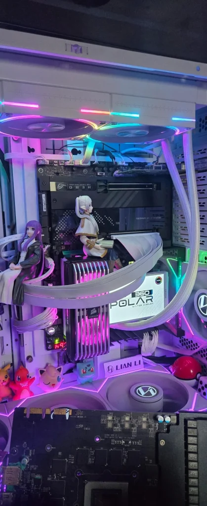 A custom PC build featuring an unbranded motherboard, Corsair RAM, an MSI water block labeled 'CORELIQUID 360 POLAR,' Lian Li case parts, RGB lighting, anime figurines, and Pokémon collectibles.