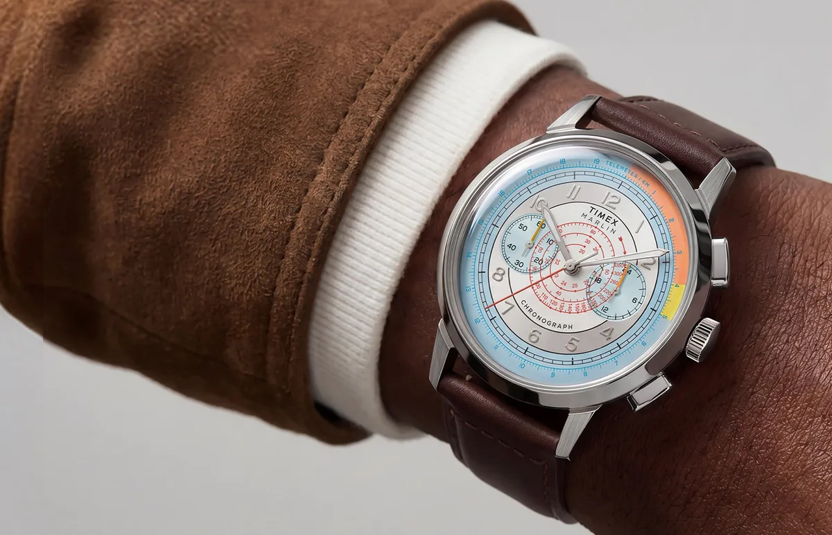 Timex Marlin Chronograph vintage 1930s — Timex Marlin Neo Classic Chronograph with a colorful silver dial and brown leather strap worn on a wrist.