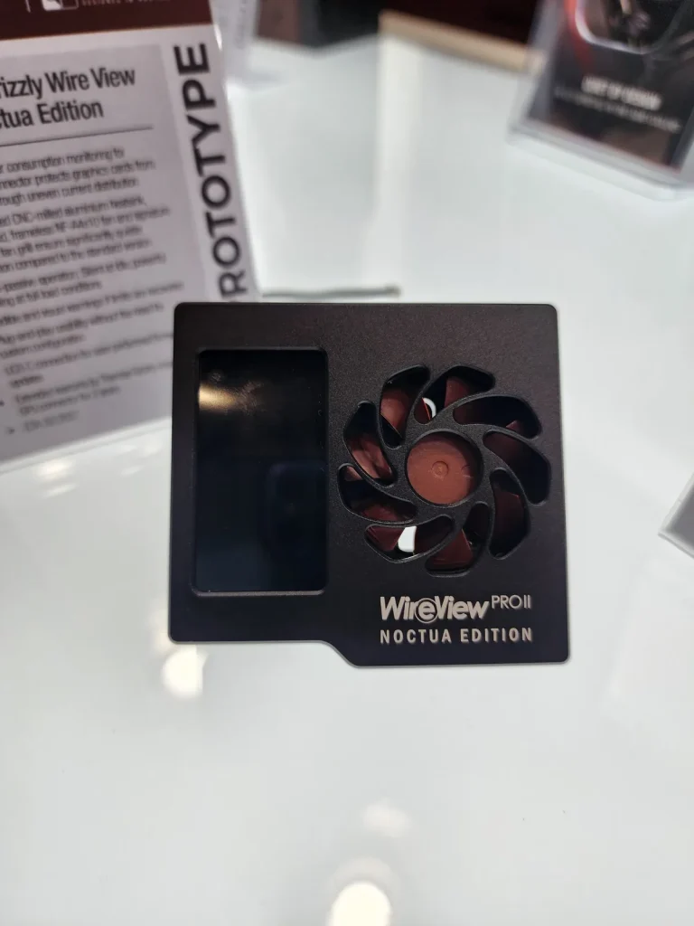 A WireView PRO II Noctua Edition prototype with an integrated fan and display is shown on a reflective surface.