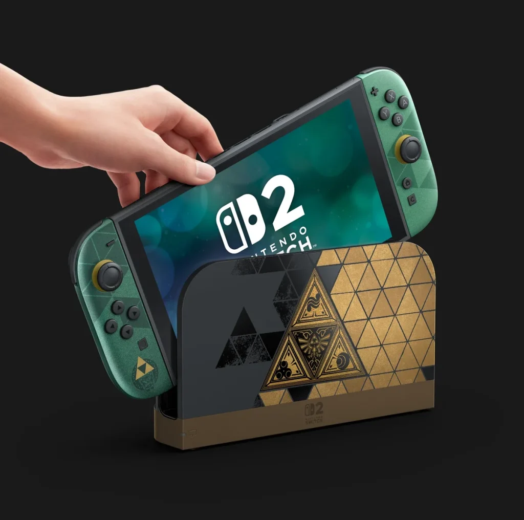 A hand inserts a green-themed Nintendo Switch console, labeled 'Switch 2', into a dock featuring gold and black triangle patterns.