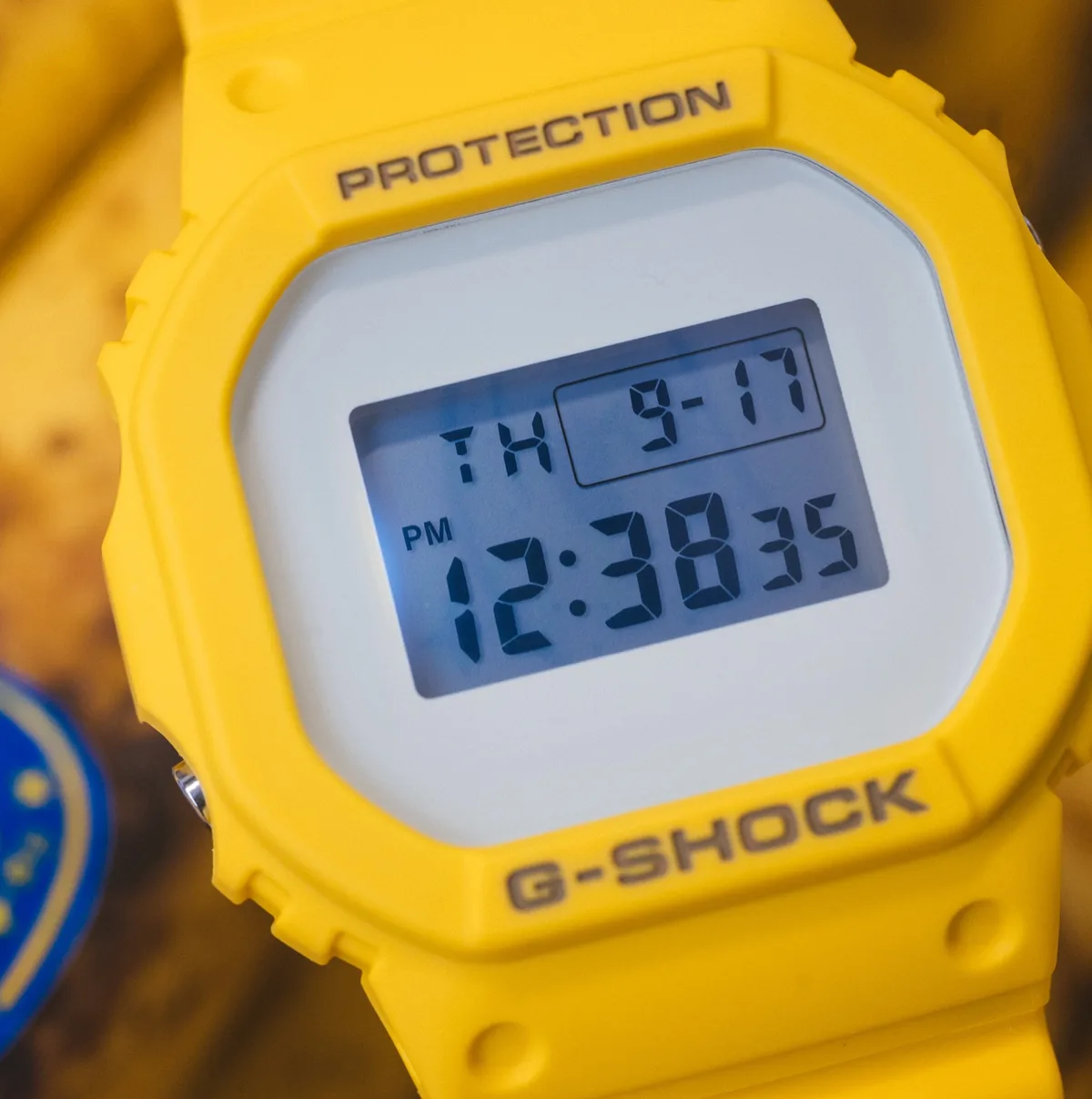 The DW5600BAIT26-9 watch has a bright banana-yellow resin case